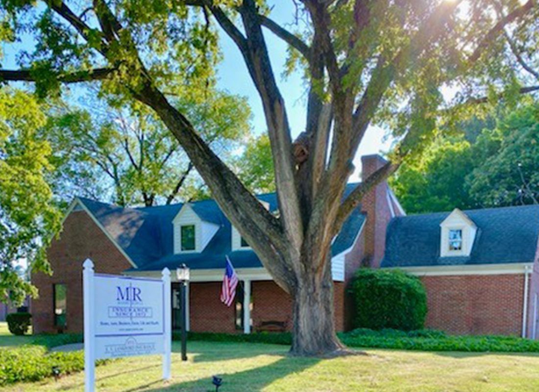 Emporia, VA - Emporia, VA Office of Manry Rawls, LLC Displaying Agency Signage and Large Tree in Front of the Office